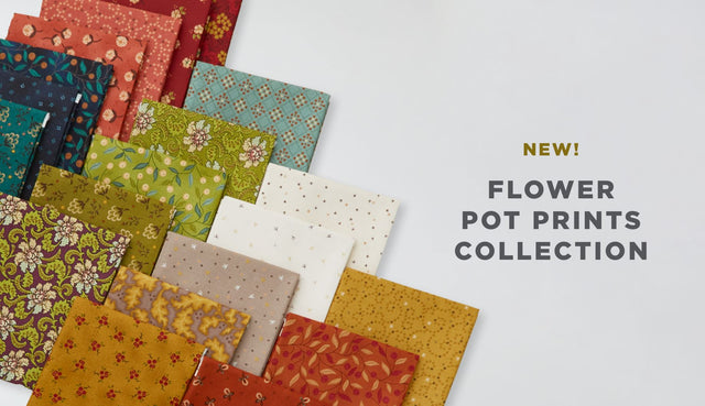 Peach-colored berries and teal leaves on a green background from the Flower Pot Prints fabric collection by Kim Diehl.