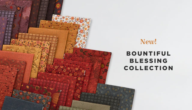 Cotton quilting fabric with a cheater print of a crazy-quilt design featuring autumn colors and motifs.