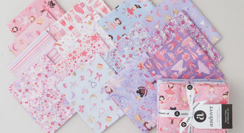 Fat quarter bundle of cotton quilt fabric with a ballet theme.