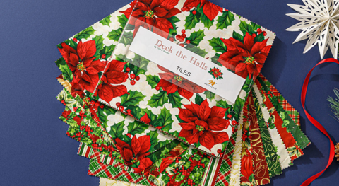 Tiles (10" squares) of holiday prints in red, cream, gold, and green. 