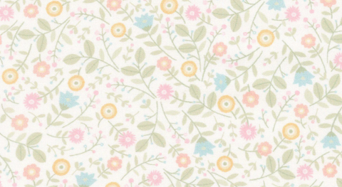 Pink, blue, and yellow flowers with green leaves on a warm white background from the Layla fabric collection by Chelsea Designworks.