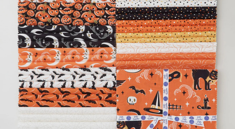 Pack of 10" squares with Halloween prints in orange, black, yellow, and white.