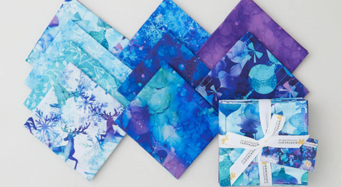 A selection of fat quarter prints from the Midwinter Magic fabric collection.