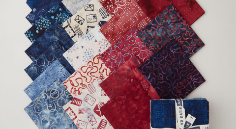 Fat quarters of batiks with an across-the-miles theme in a rewd, white and blue palette from the Missing You Batiks fabric collection.