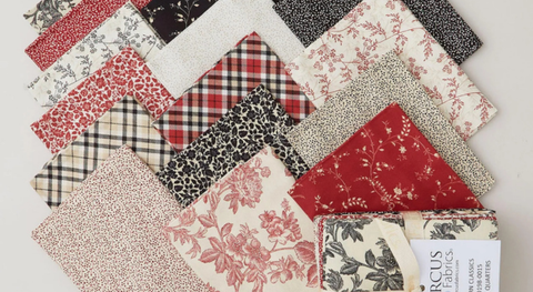 Fat quarter bundle of cotton quilt fabric featuring florals and plaid.