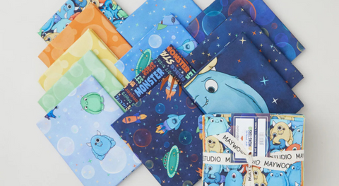 a selection of fat quarter fabrics from the space monsters fabric collection.